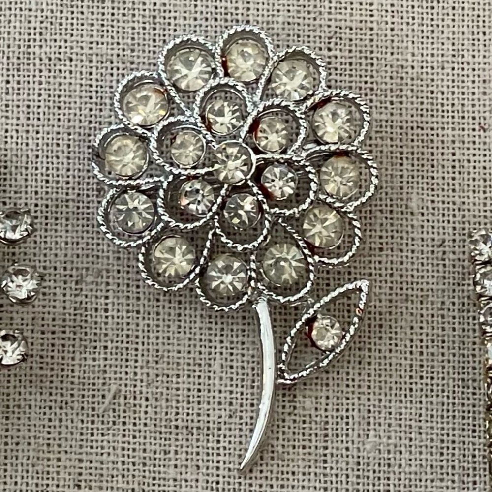 Silver Floral and Geometric Brooch Set